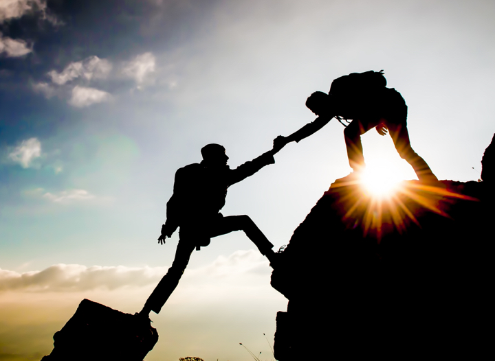 climbers helping each other